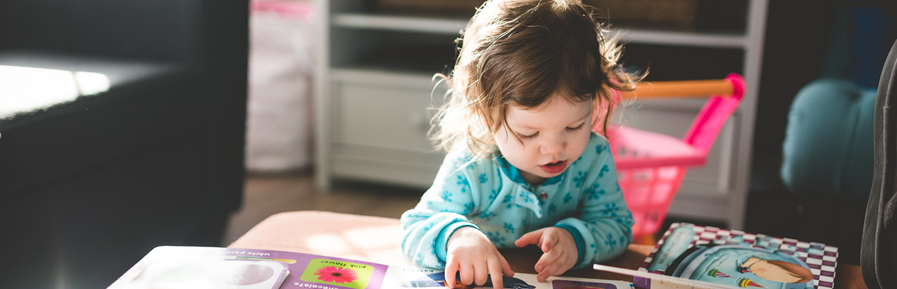 Little girl reading.